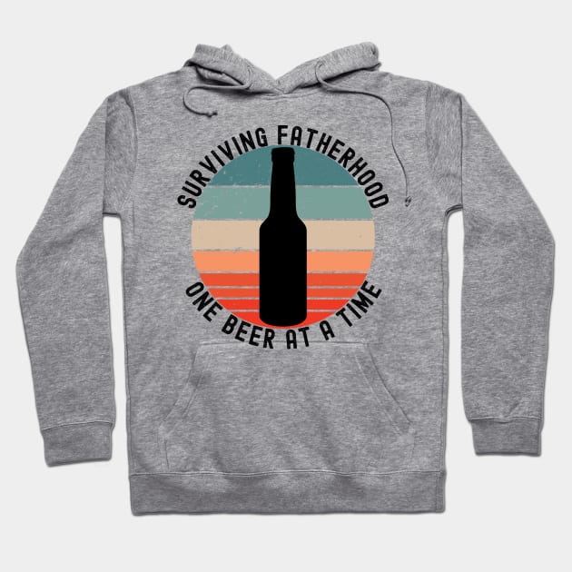 Surviving Fatherhood One Beer At A Time. Funny Dad Life Quote. Hoodie by That Cheeky Tee
